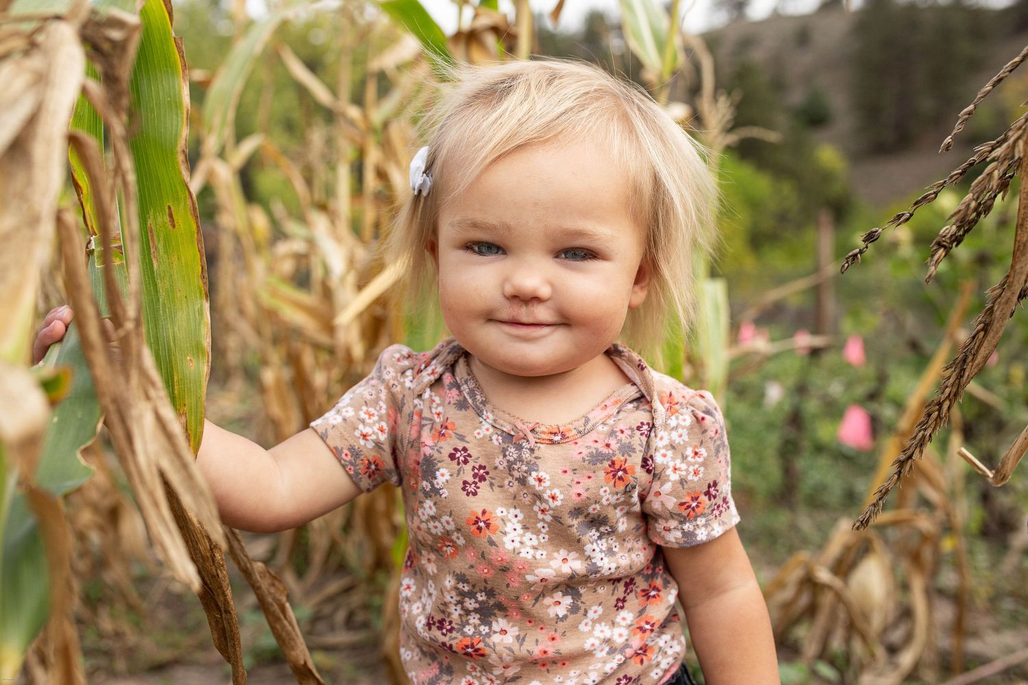 Baby girl growing and learning to love her garden in the black hills of south dakota.