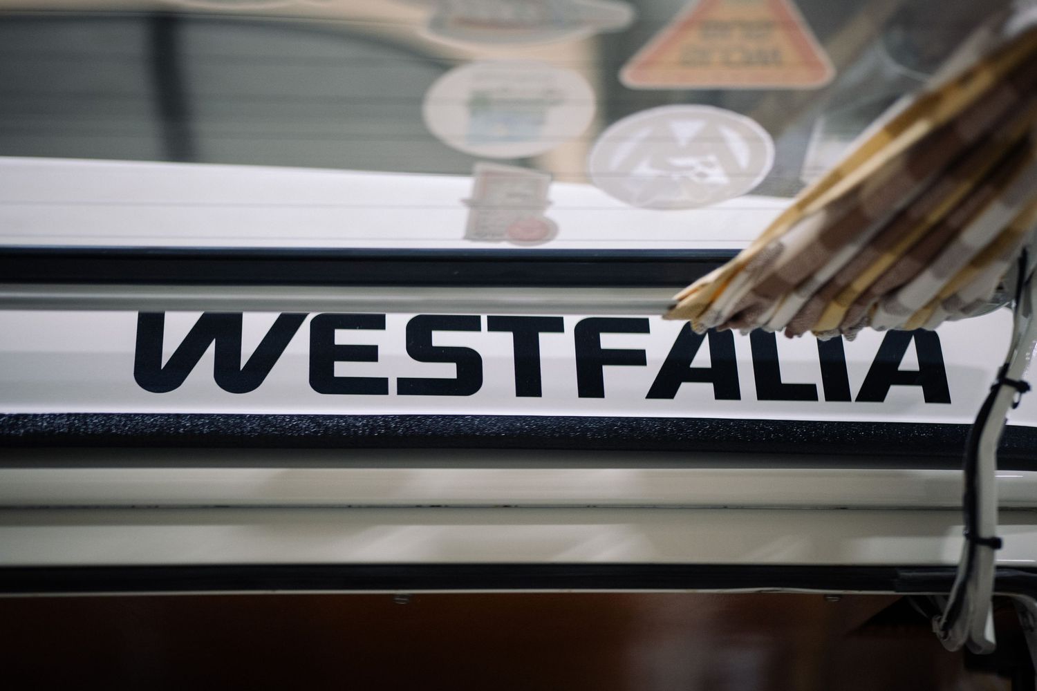 A series of close-up photos showing various parts and details of a Westfalia camper van.
