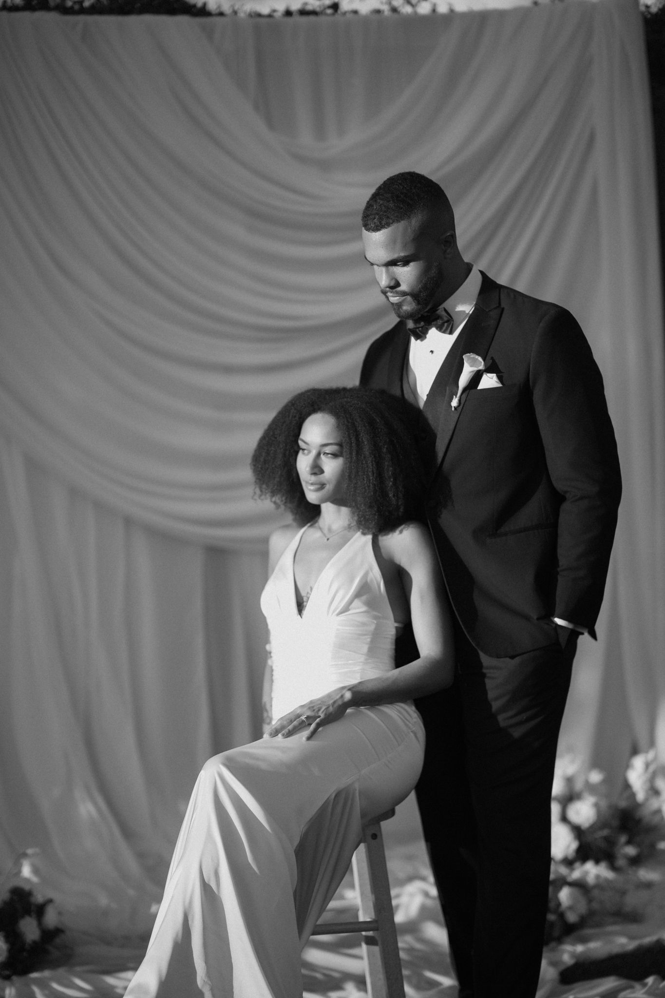 Romantic wedding portraits of a Black couple at sunset in Arizona Black bride and groom walking together after their wedding ceremony
