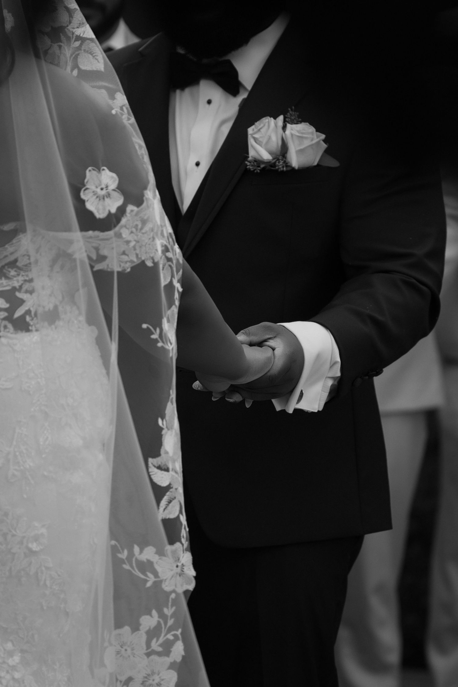 Black bride and groom walking together after their wedding ceremony