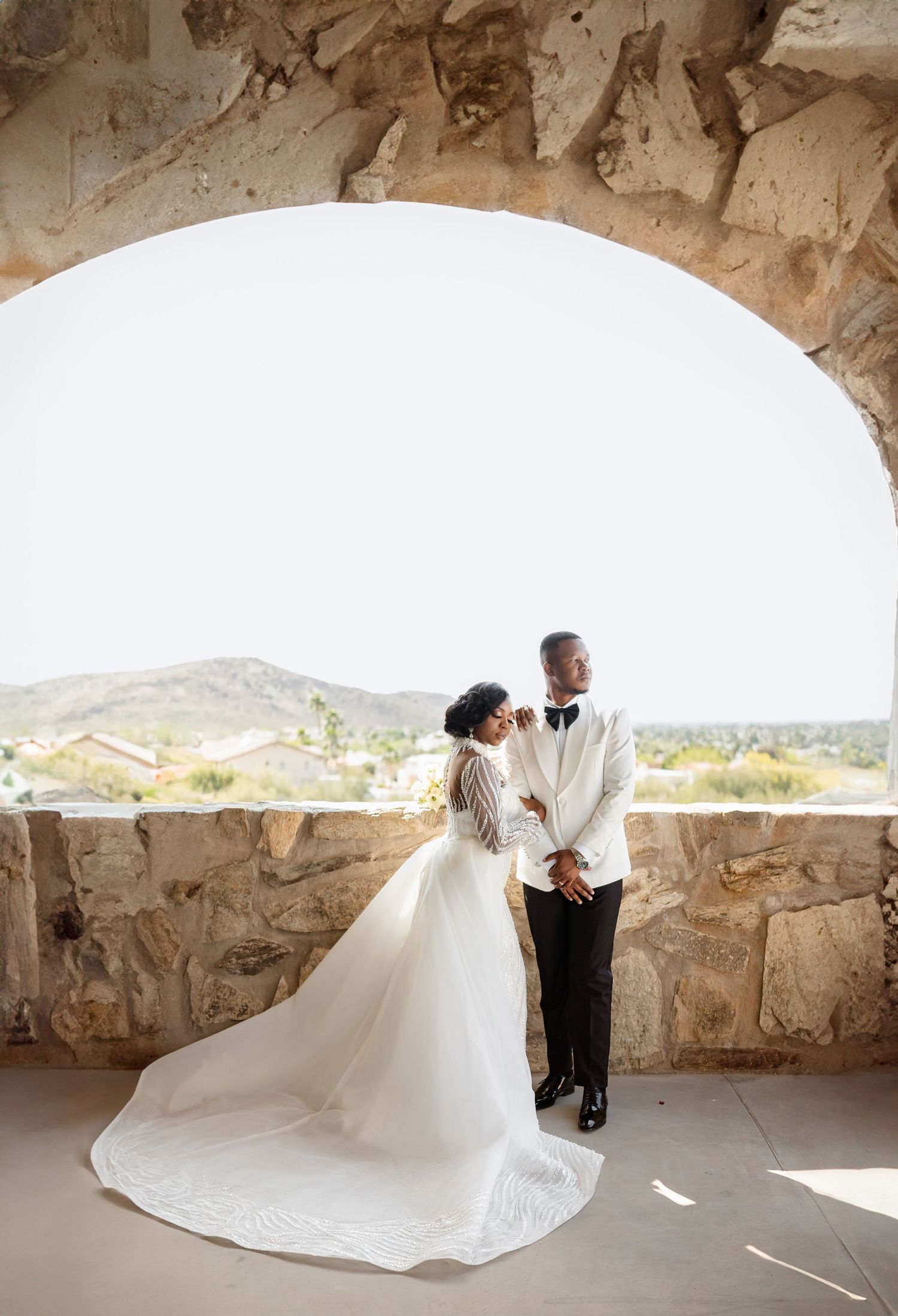 Romantic wedding portraits of a Black couple at sunset in Arizona Black bride and groom walking together after their wedding ceremony