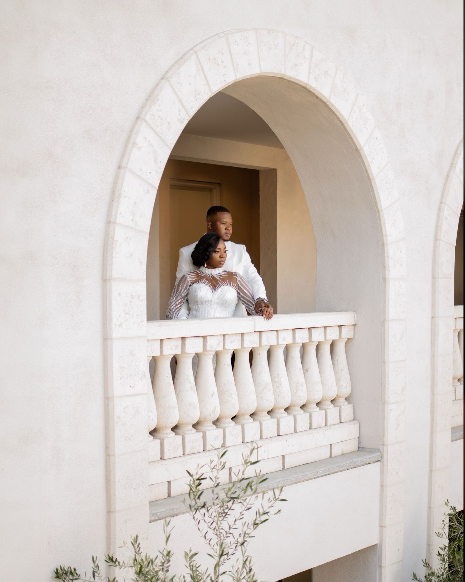 Black bride and groom walking together after their wedding ceremony