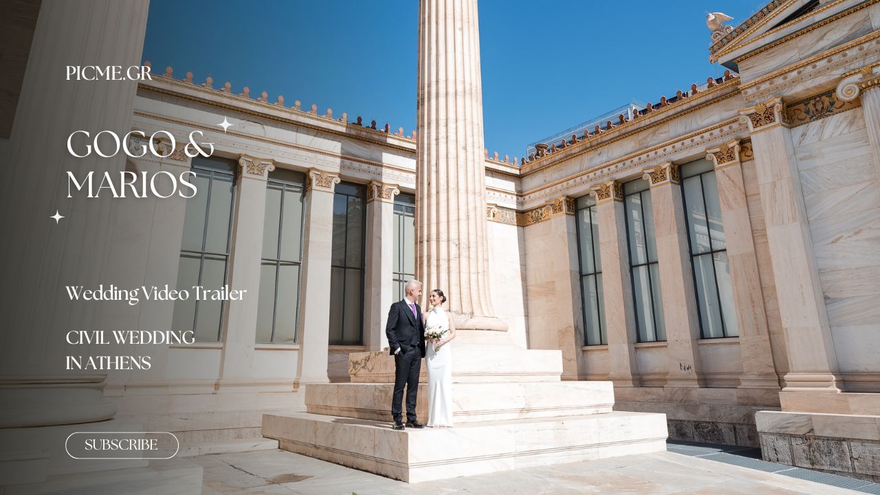 Panoramic view of classical Greek architecture with white marble columns and walkways at a historic building entrance.