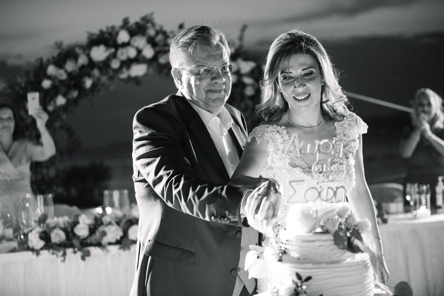 Elegant black and white wedding photo collage showing celebratory moments from the reception and dance floor.