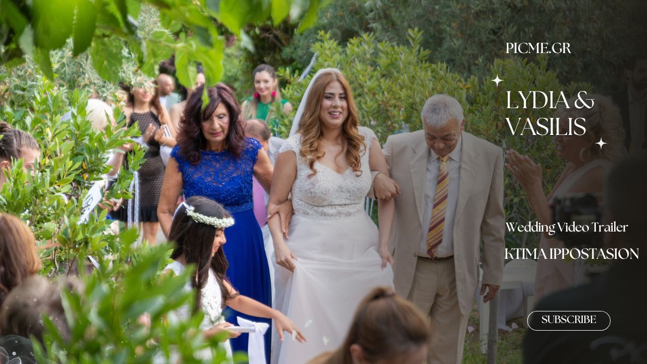 Wedding party walks together through a lush green outdoor pathway on a summer day.