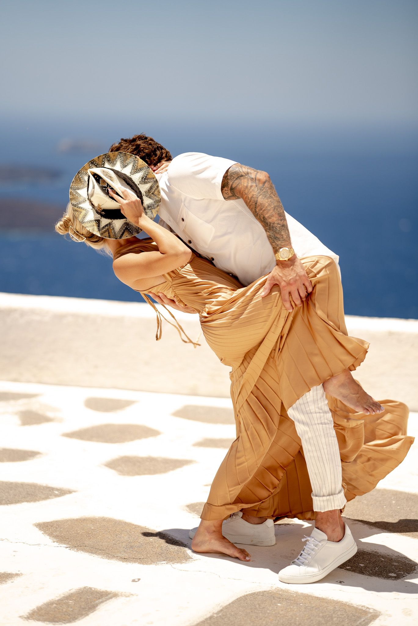 Dynamic dance moves captured in sequence against bright beachfront setting.