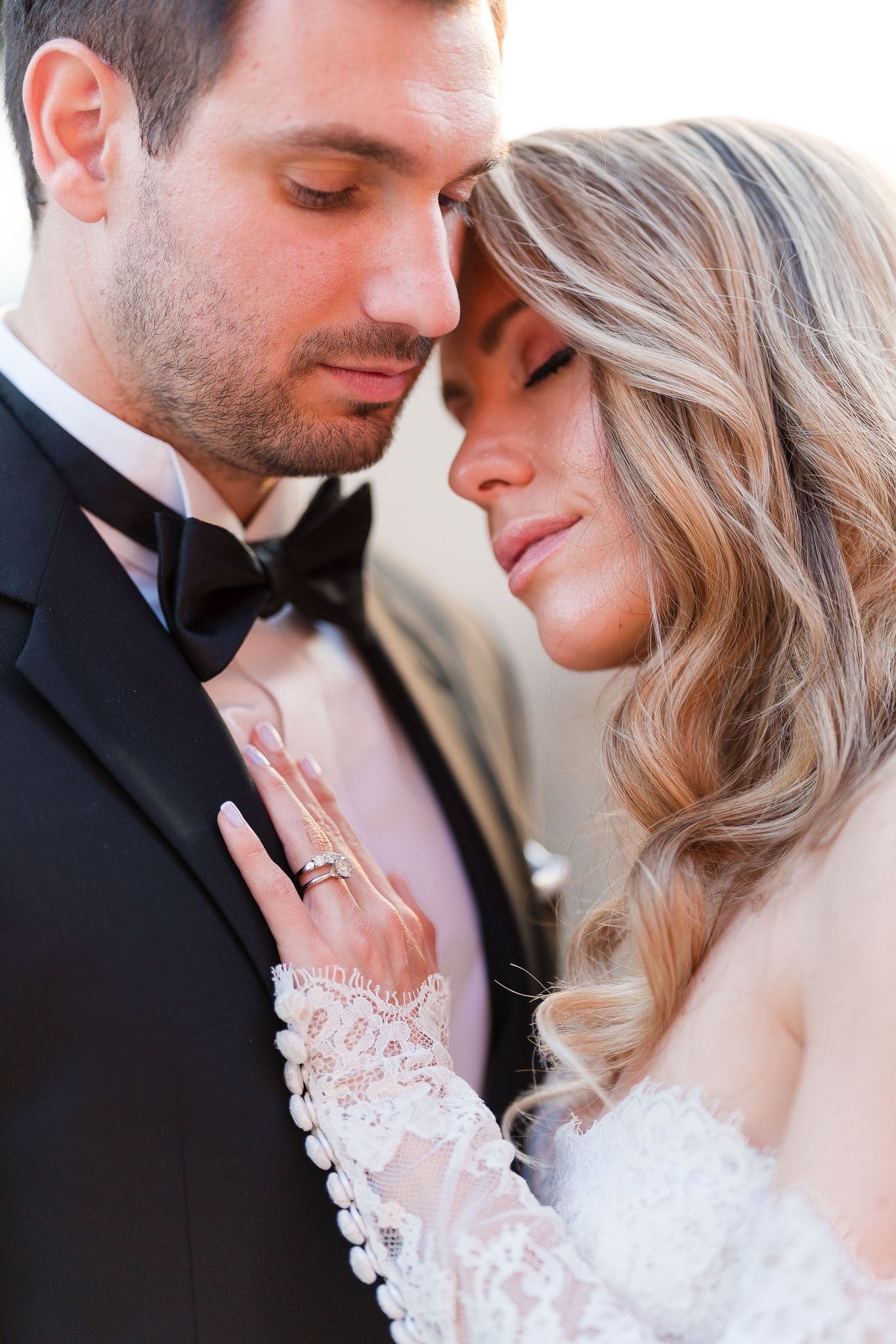 Soft romantic wedding portraits showing tender intimate moments in natural light.