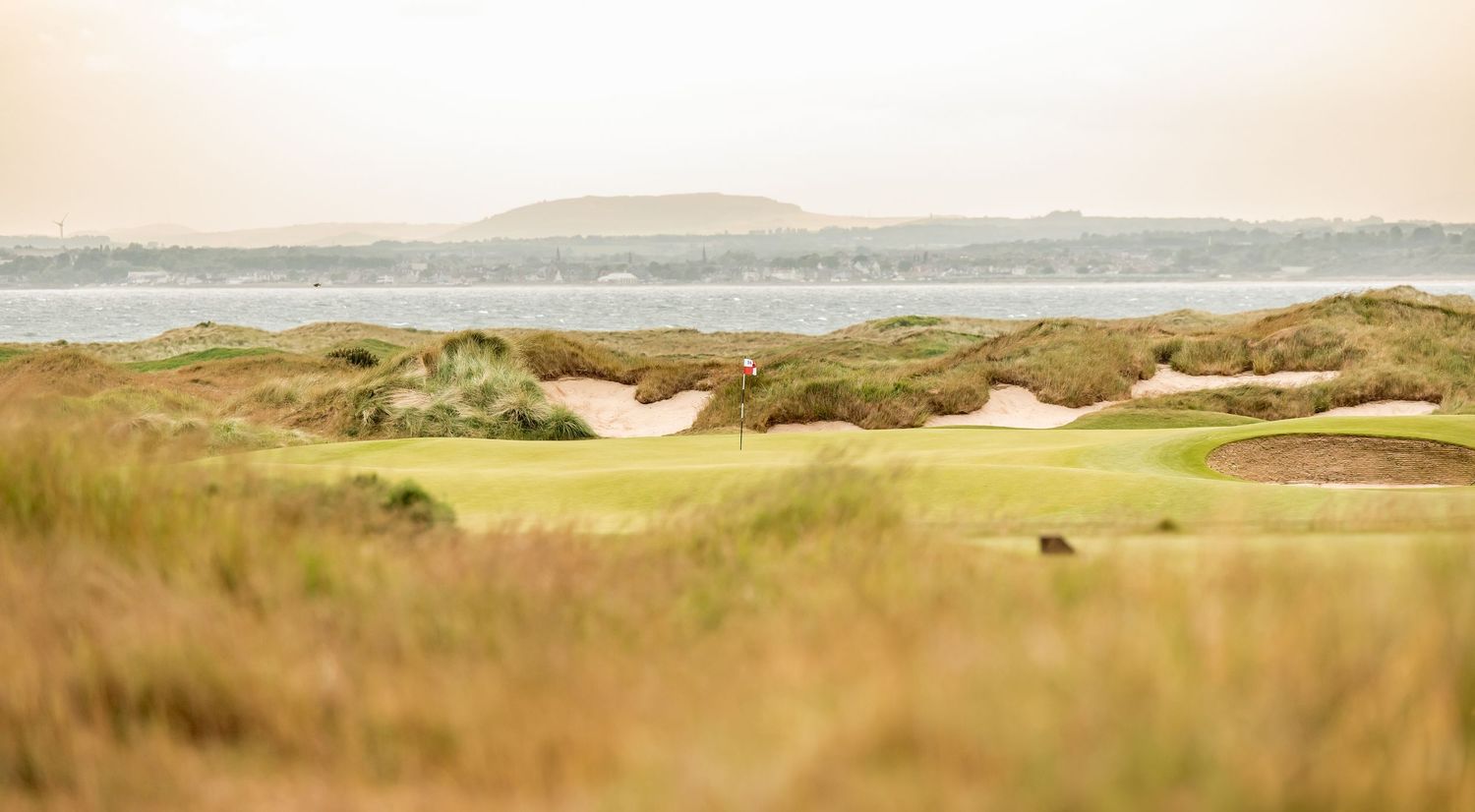 Mid-day view of Dumbarnie Links on a cloudy day.