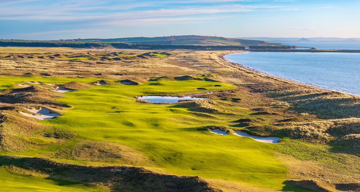 Landscape photography of golf course at seaside
