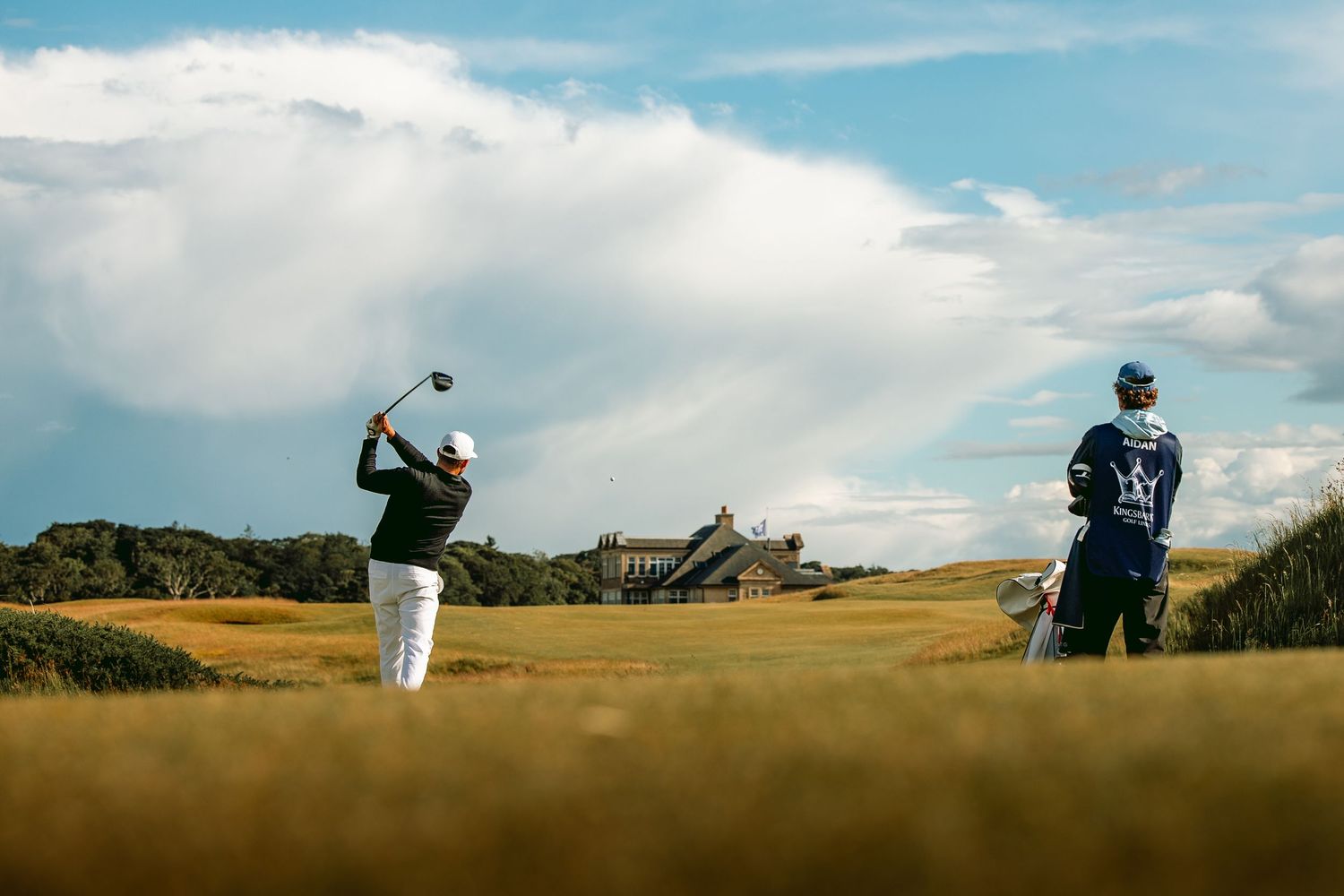 Two golfers playing at kingsbarns links in a sunny weather