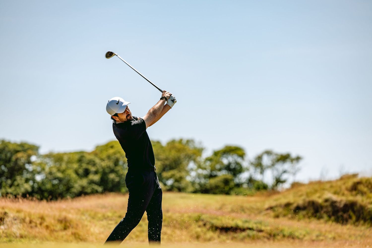 A golfer wearing white cap played a perfect shot at Kingsbarns Links.