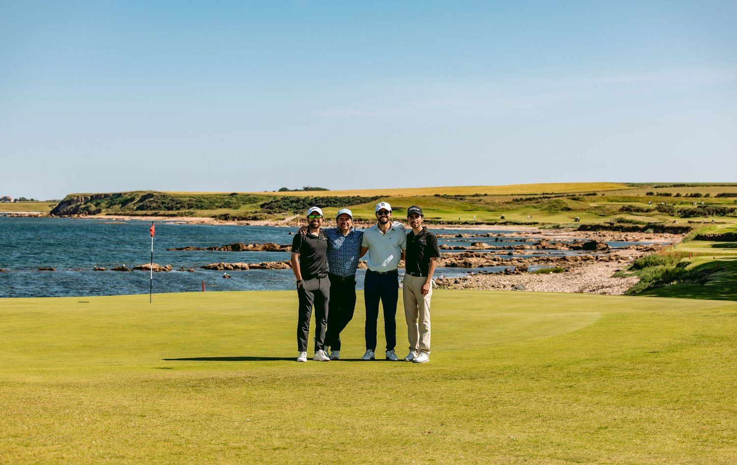 A group of 4 golfers enjoying golf trip at Kingsbarns Links.