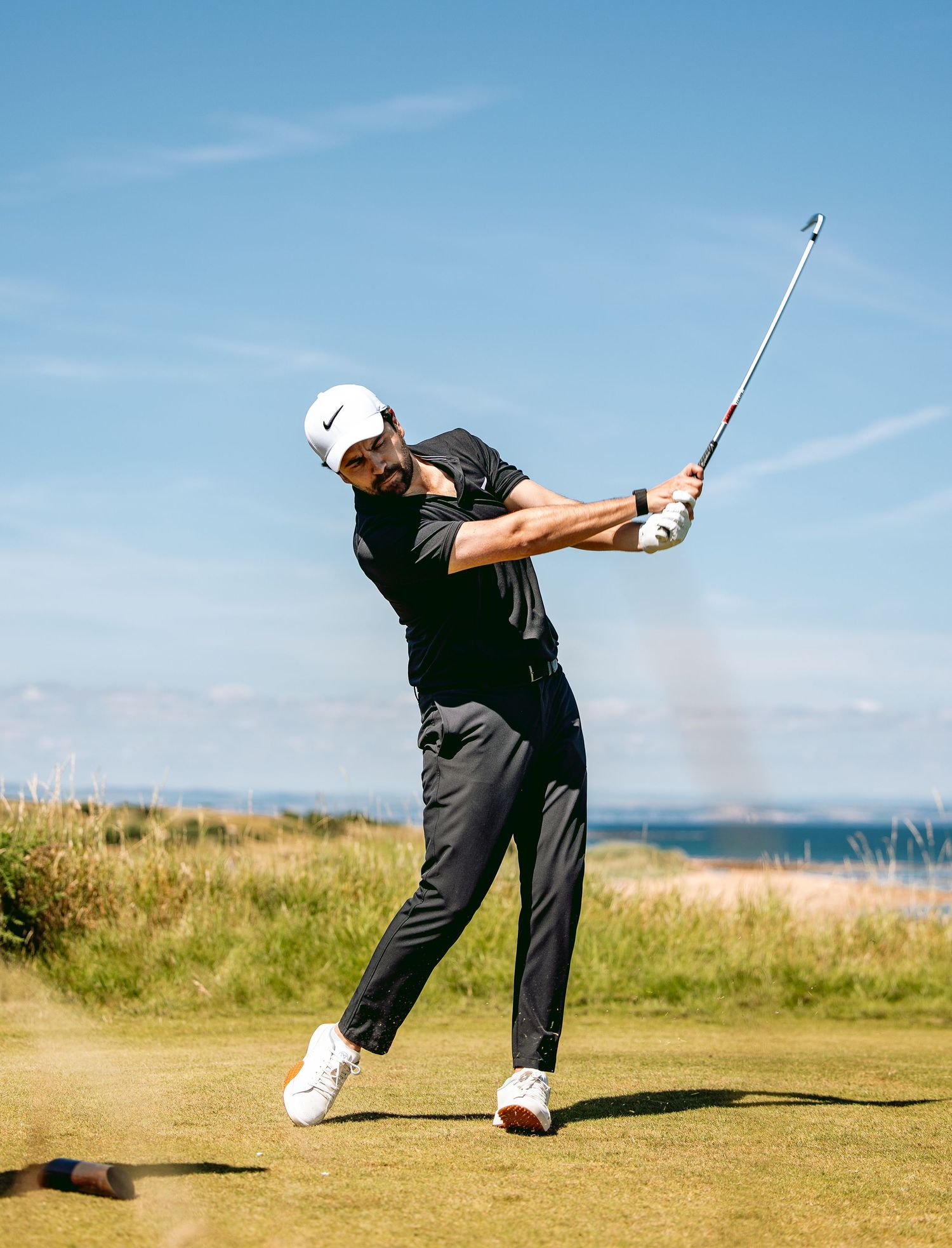 A golfer, in action, played a perfect shot at Kingsbarns Links