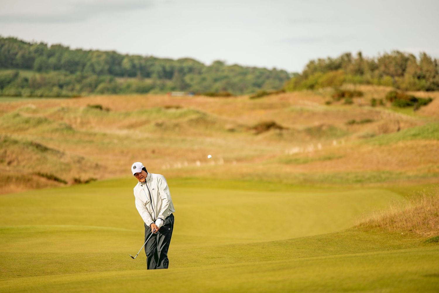 A golfer at Dubarnie Links is ready to play his shot.