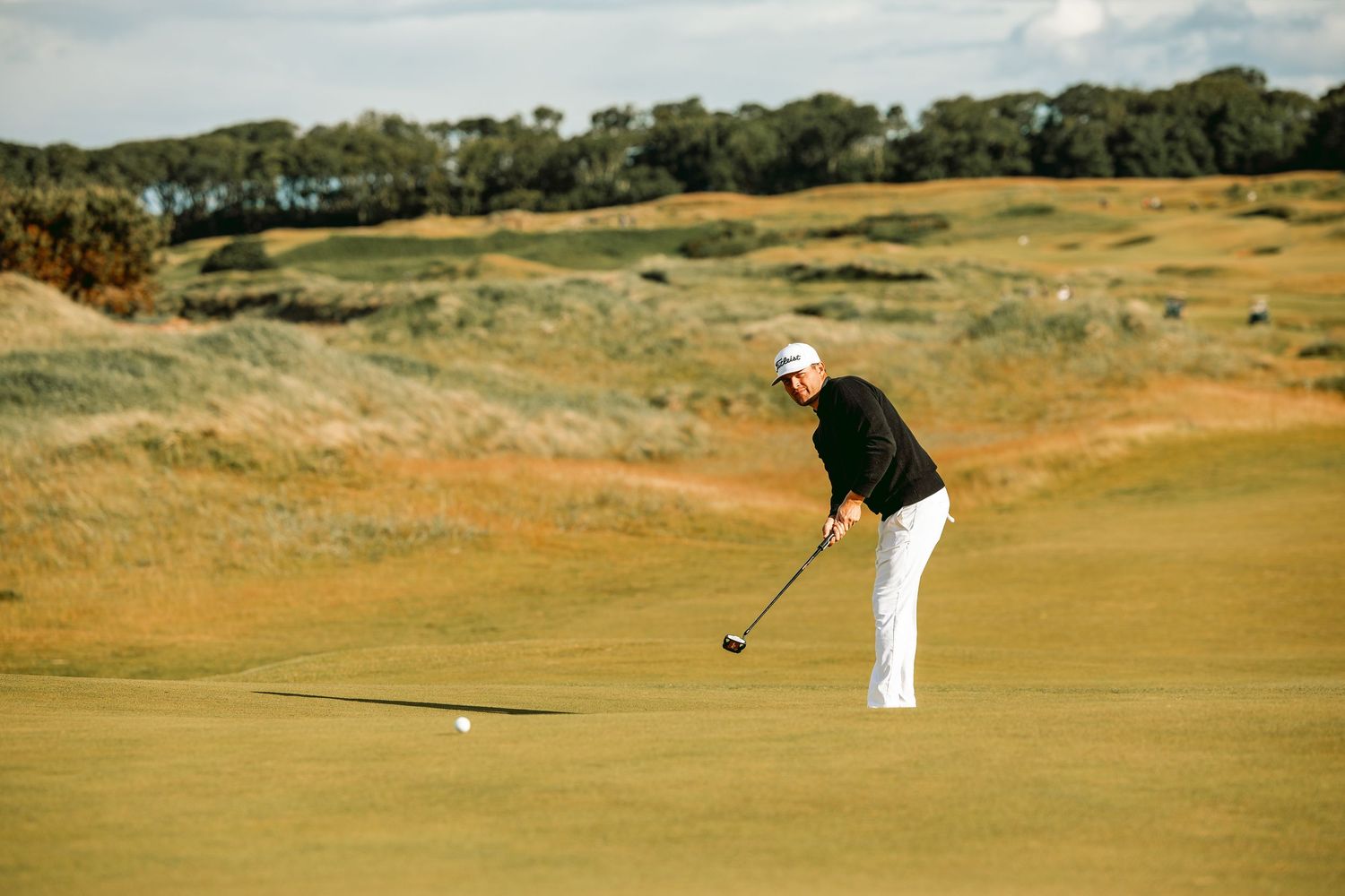 Golfer hit the ball towards the cup/hole at kingsbarns links