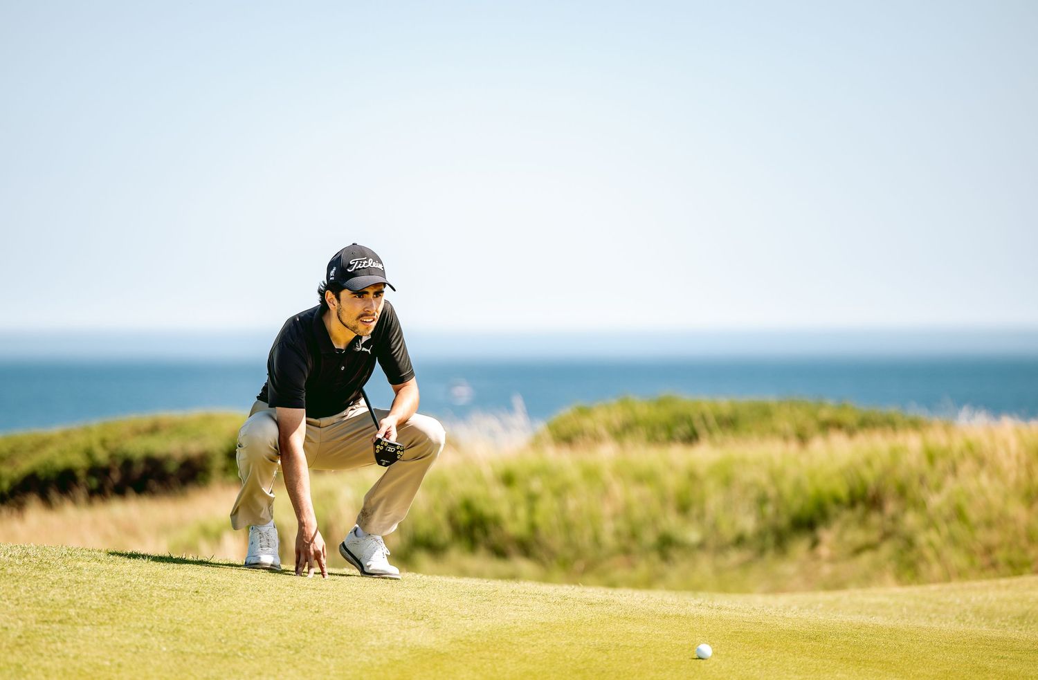 A golfer at Kingsbarns Links calculating his next golf shot.