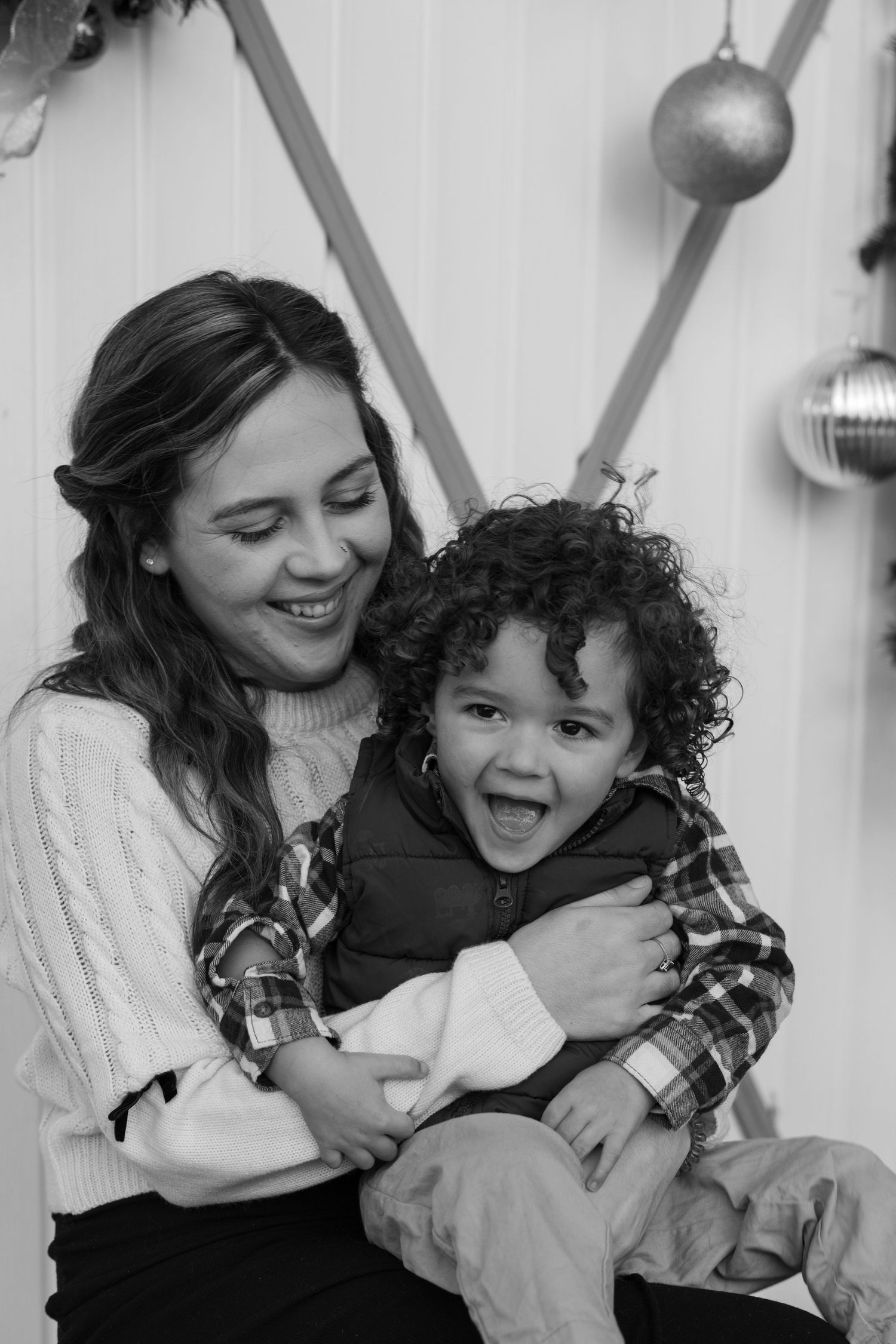 Black and white series of joyful candid moments between parent and child.