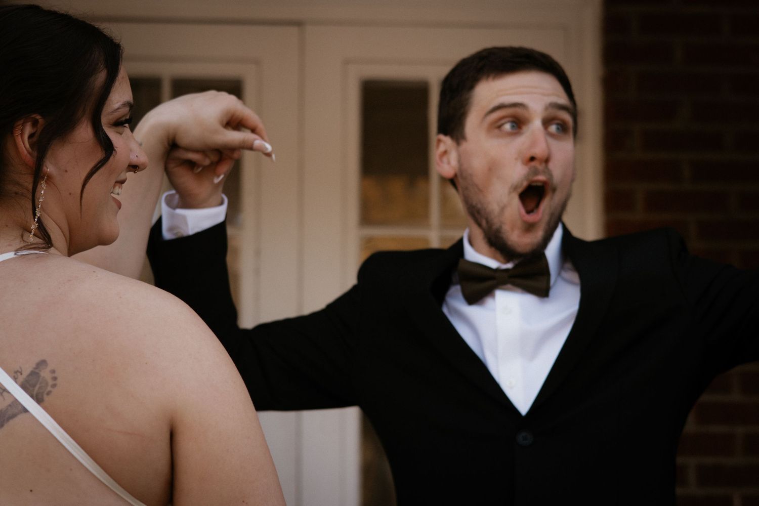 Candid wedding couple moments captured in elegant indoor setting.