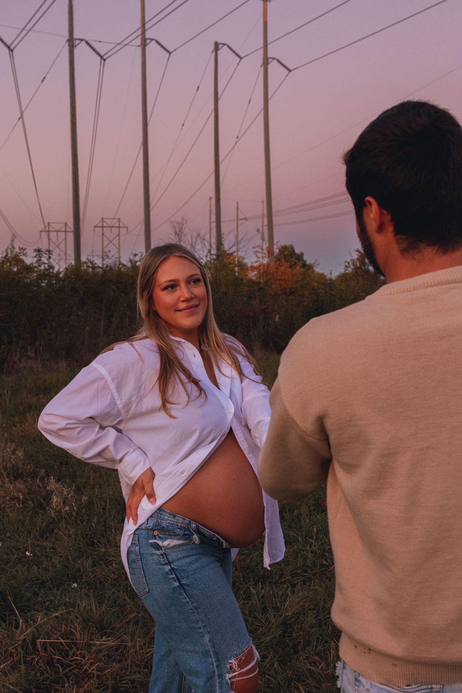 Series of five photos showing a playful couple in casual attire dancing in an outdoor setting at sunset.