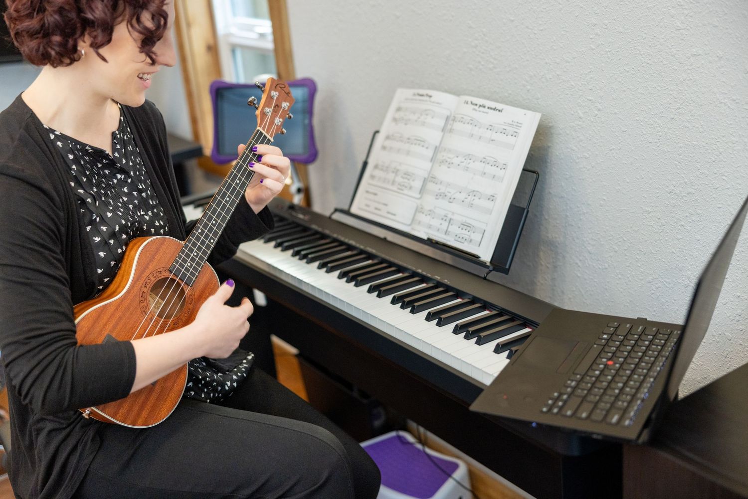 Musical instruments including violin and piano in a studio setting.