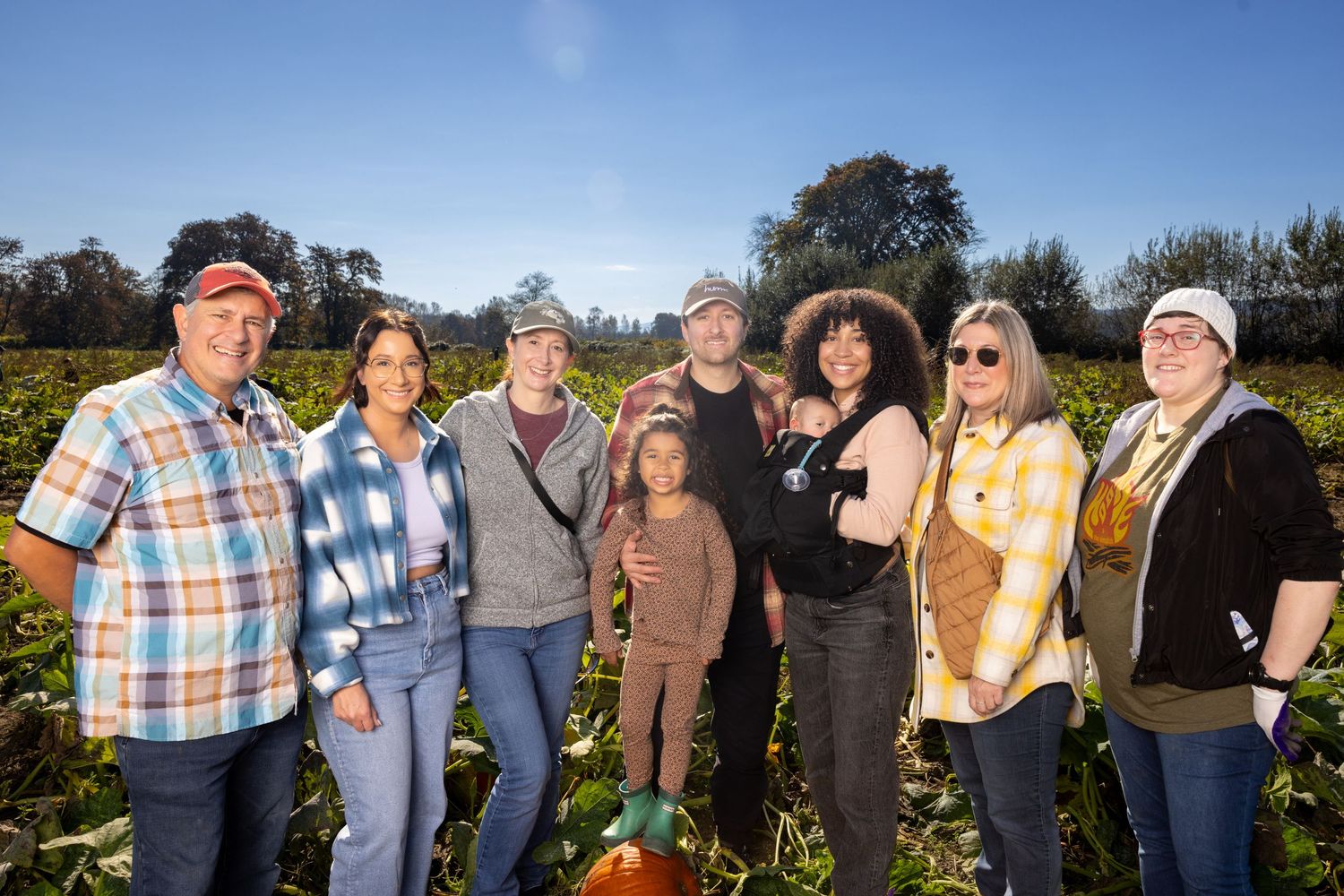 Group of friends enjoying autumn day at outdoor gathering.