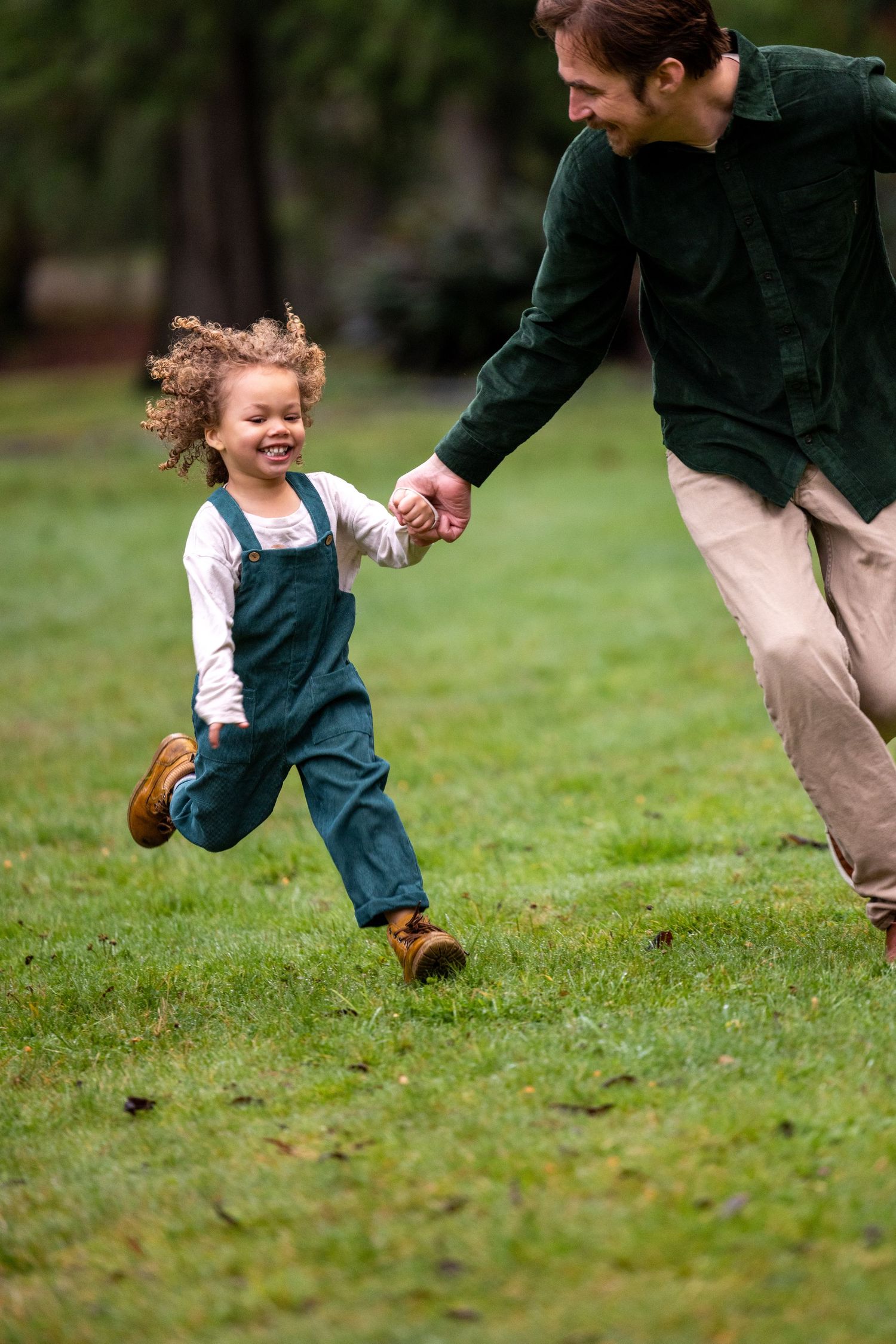 Running and playing sequence captured in a park with green grass.