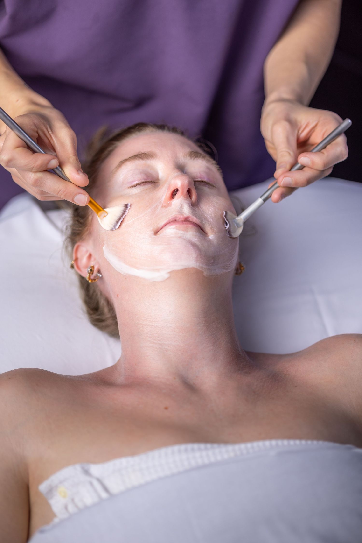 Facial treatment being applied during spa skincare service.
