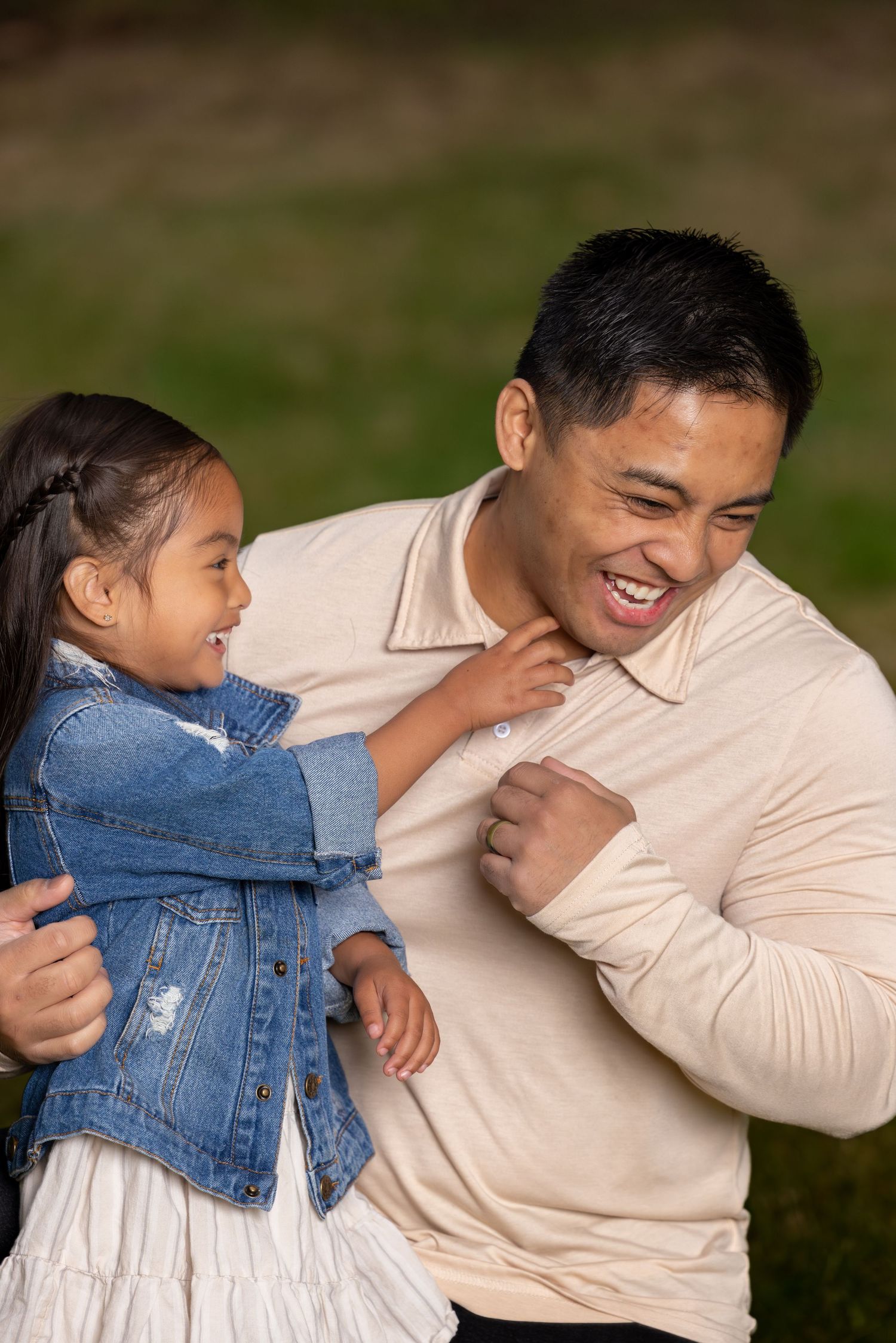 Candid sequence showing joyful interaction between parent and child wearing denim jacket.