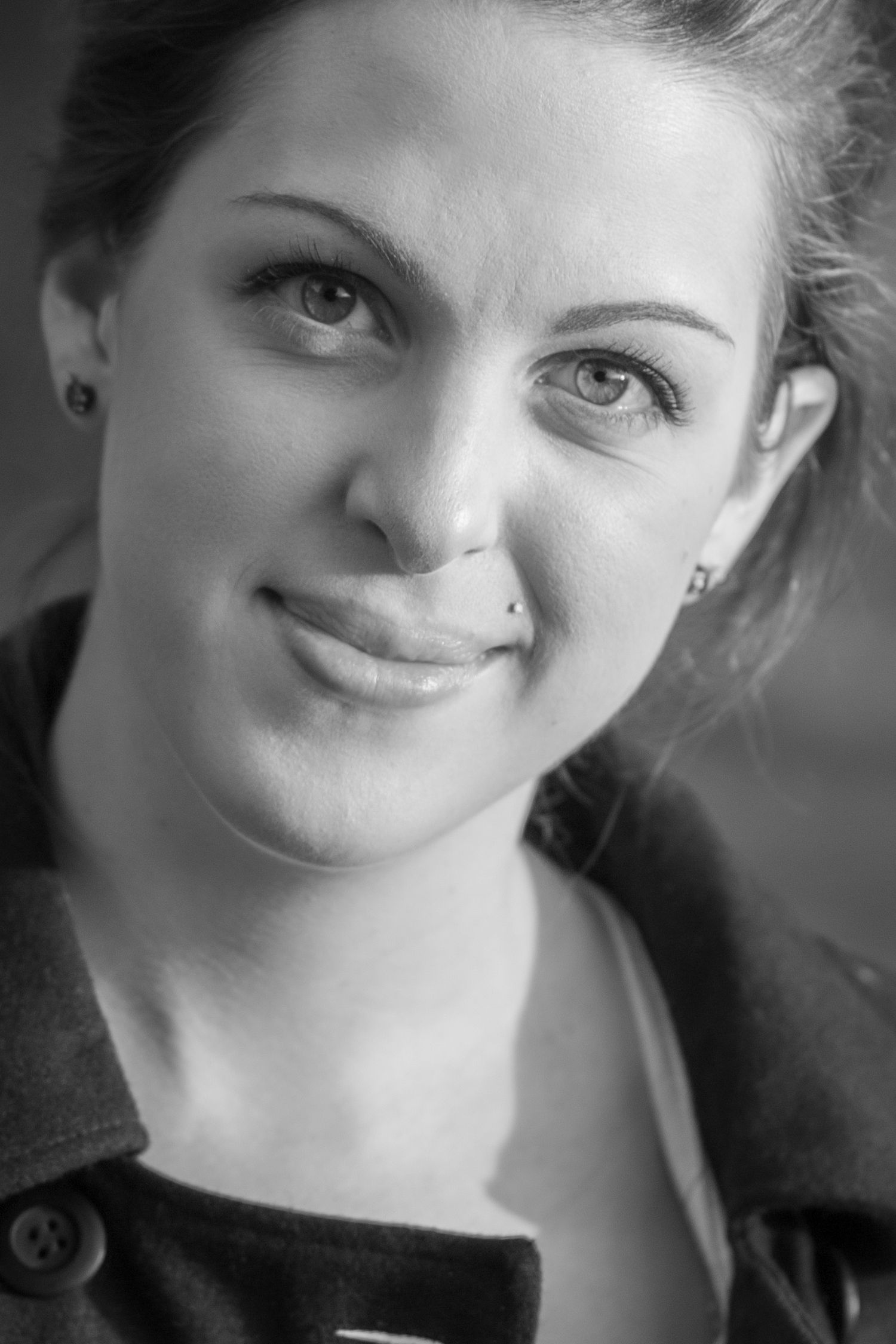 Black and white close-up portraits showing expressive facial features.