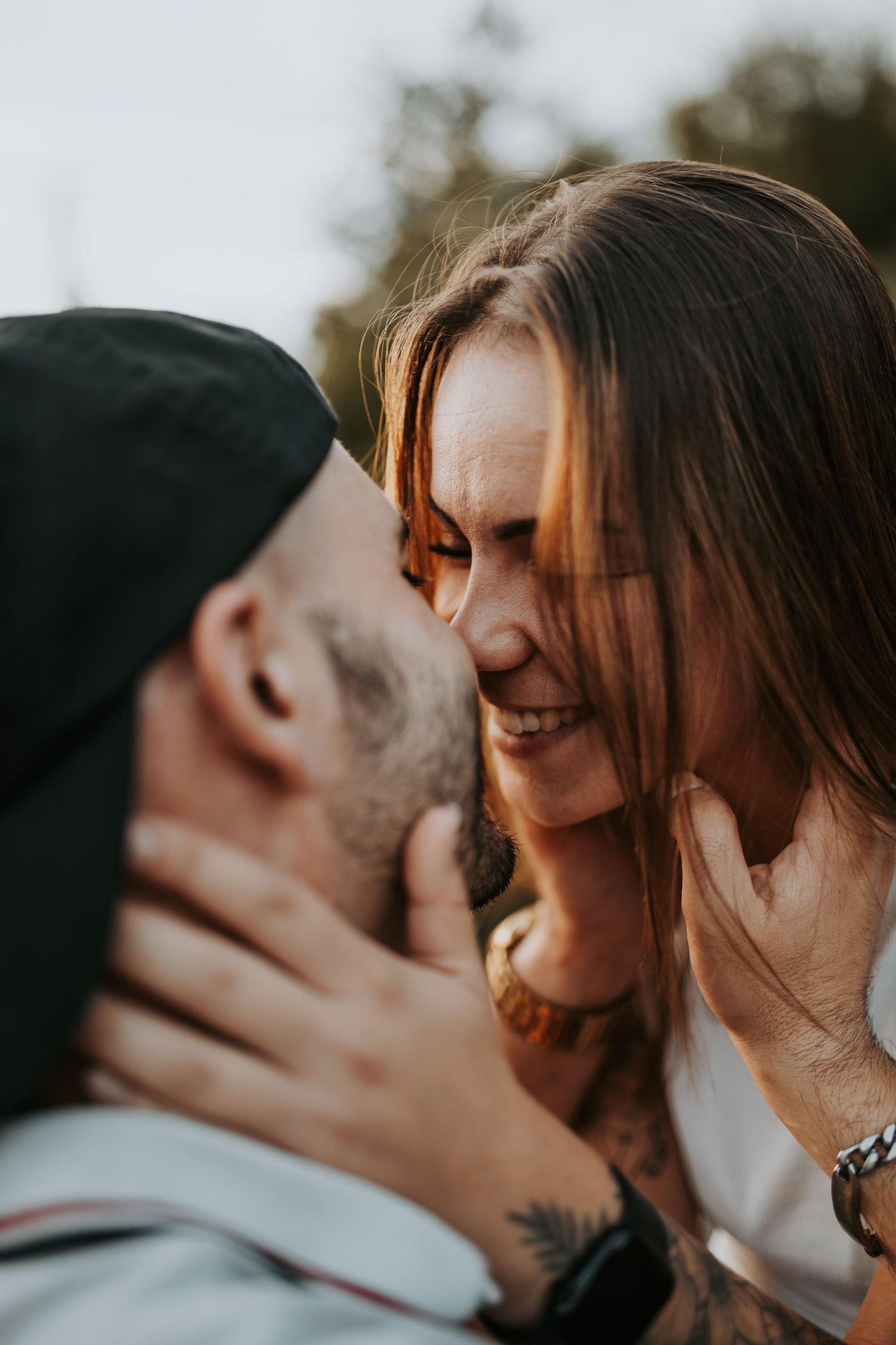Romantic couple embracing and kissing in a series of intimate close-up shots.