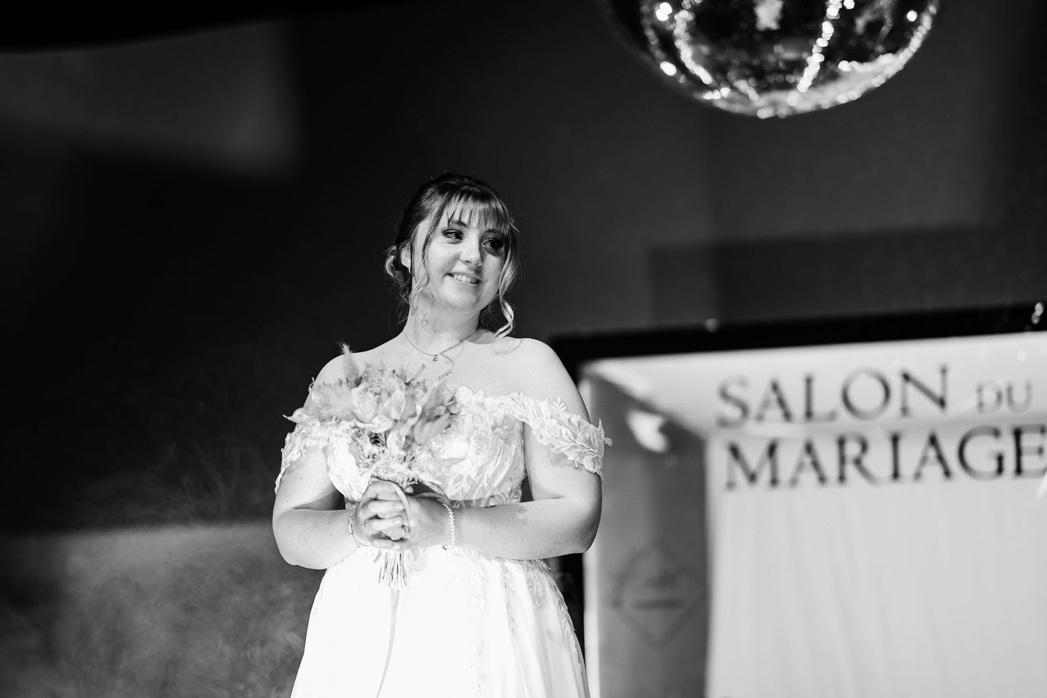 A black and white photo montage showing romantic wedding moments with disco balls in the background.