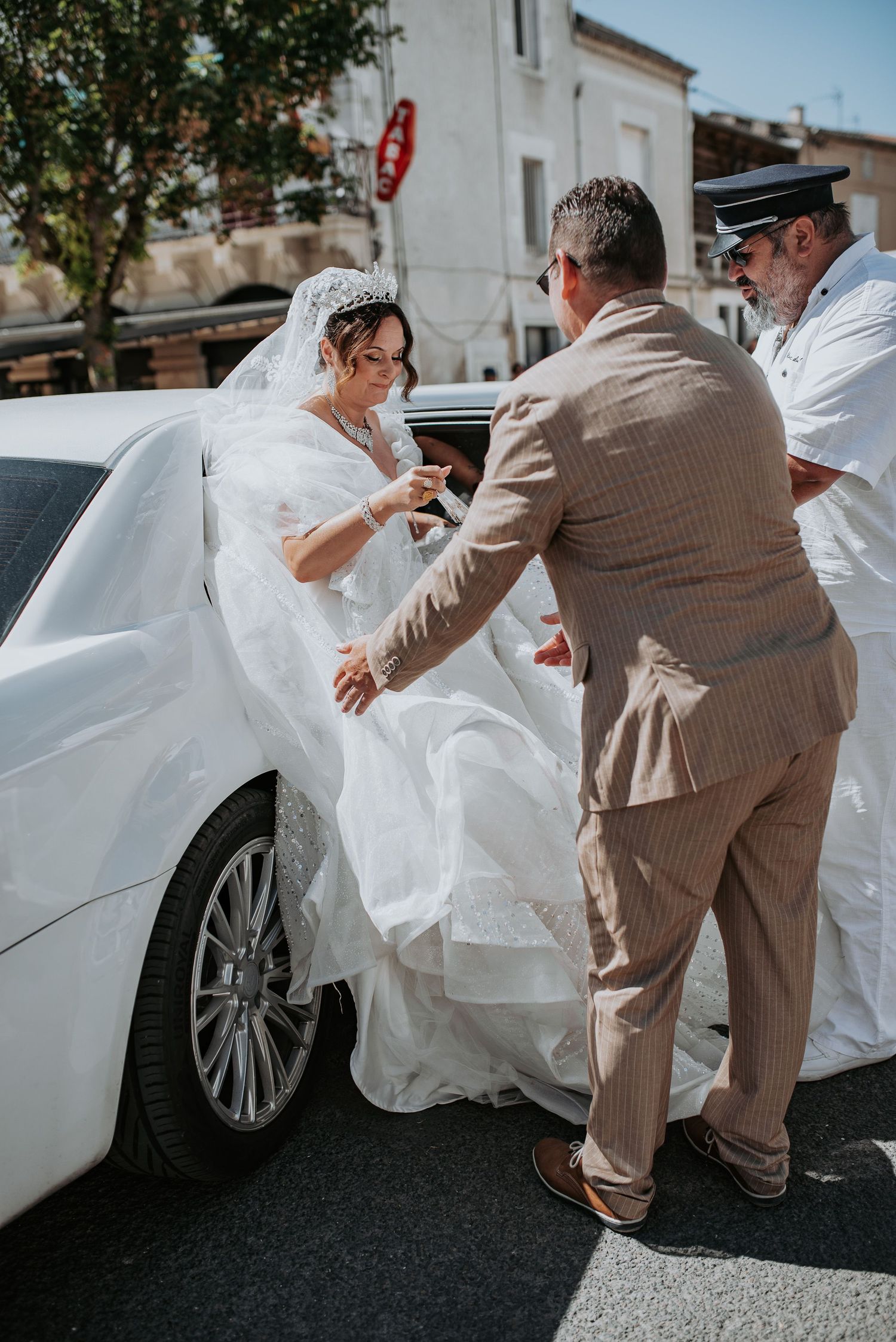 A sequence of photos showing someone helping a bride in a white dress get into a car on their wedding day.