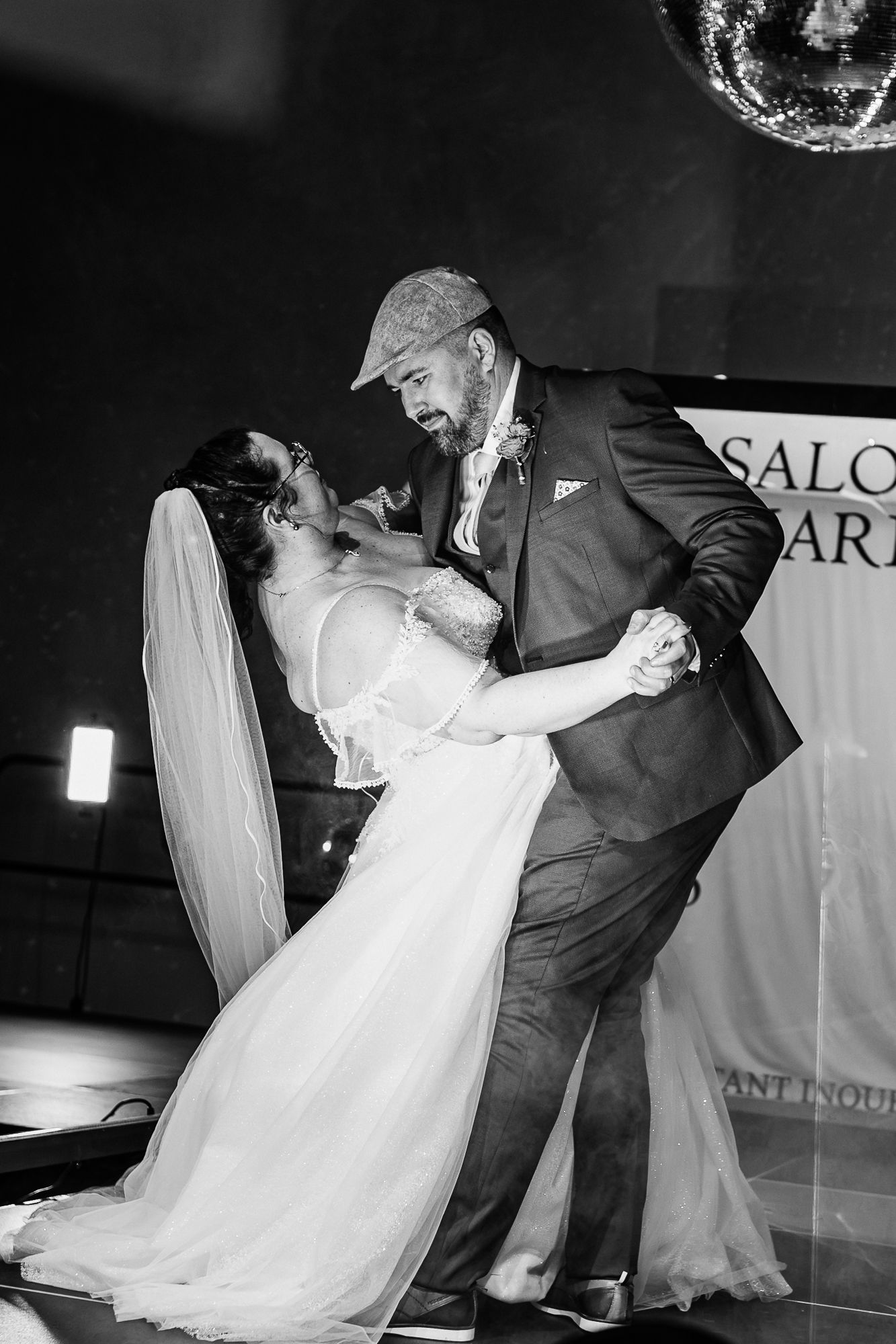A romantic black and white photo sequence shows a couple performing a dramatic dip dance move at their wedding reception.