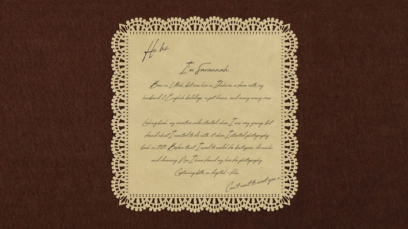 Handwritten note on vintage paper with decorative lace border against brown background.