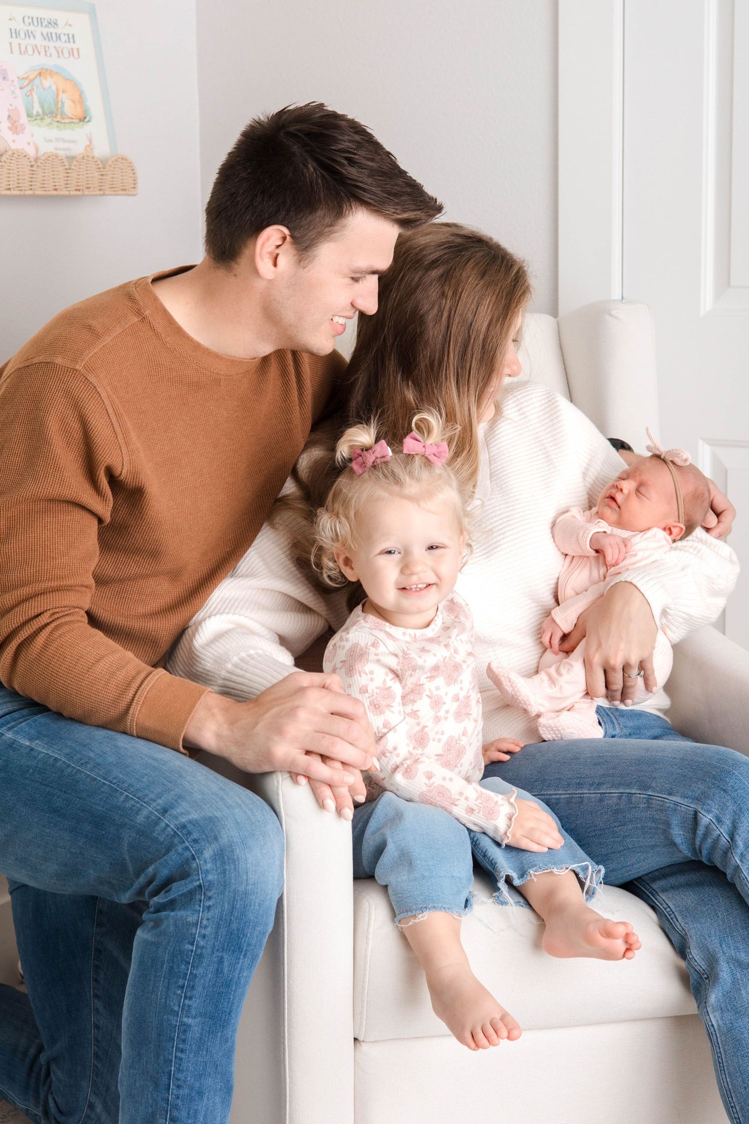 A series of candid family moments showing playful interaction on a white couch while wearing casual attire.