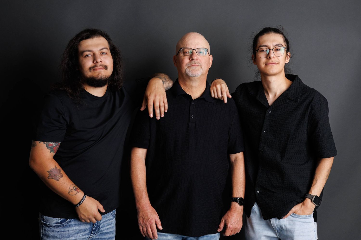 Group portrait series showing family members in black attire against dark backdrop.