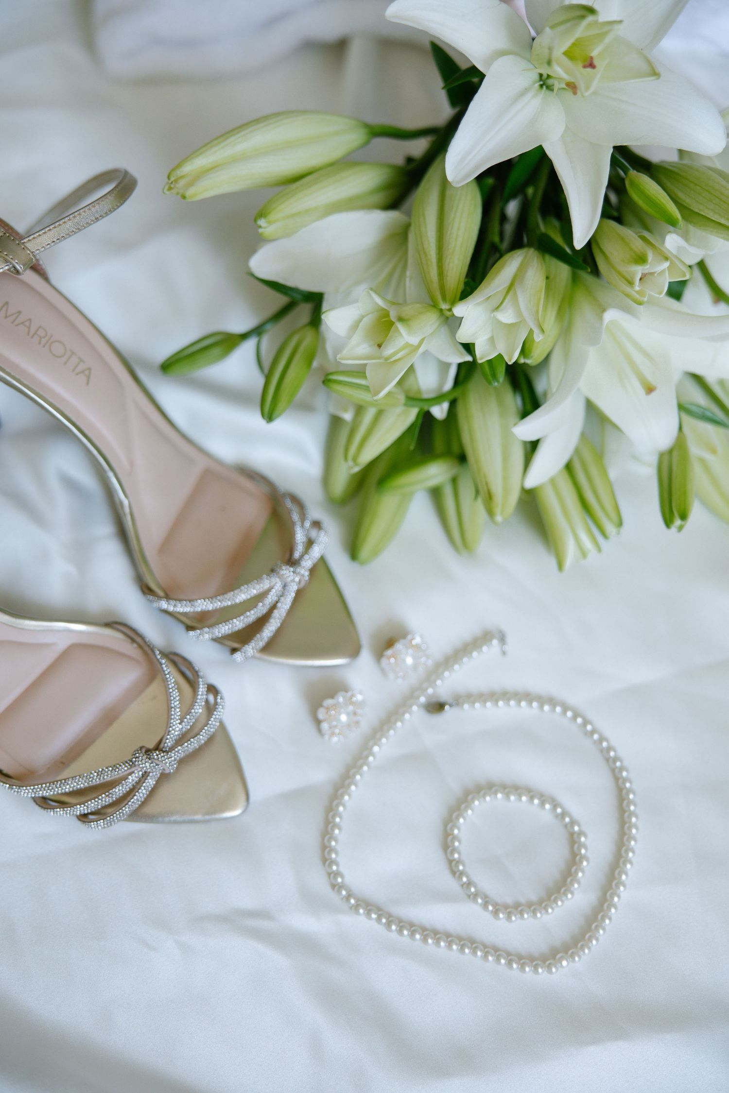 the brides wedding flowers with the jewelry and shoes