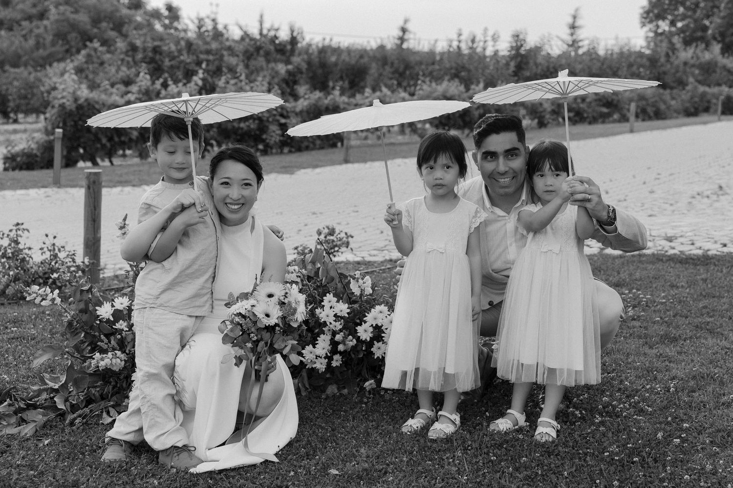Bride and groom posing with the kids on their wedding in the Algarve