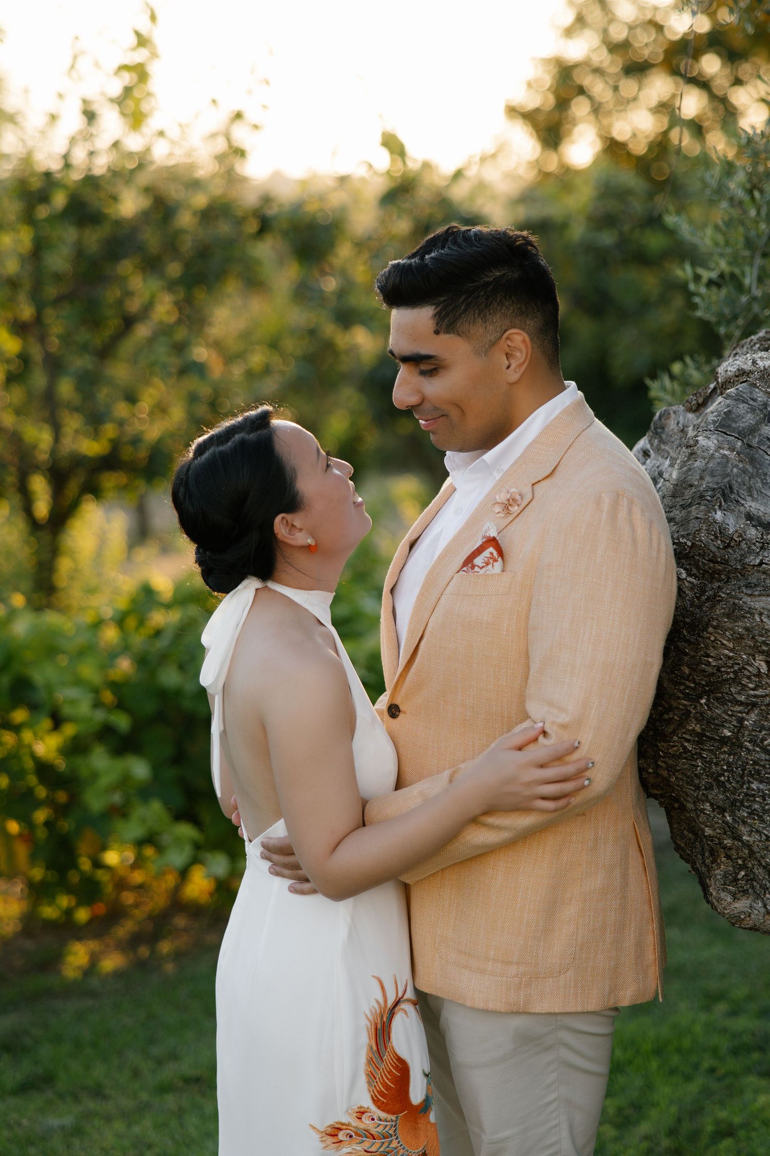 Wedding couple holding each other in green surroundings during their wedding at casa manor pedras de cima