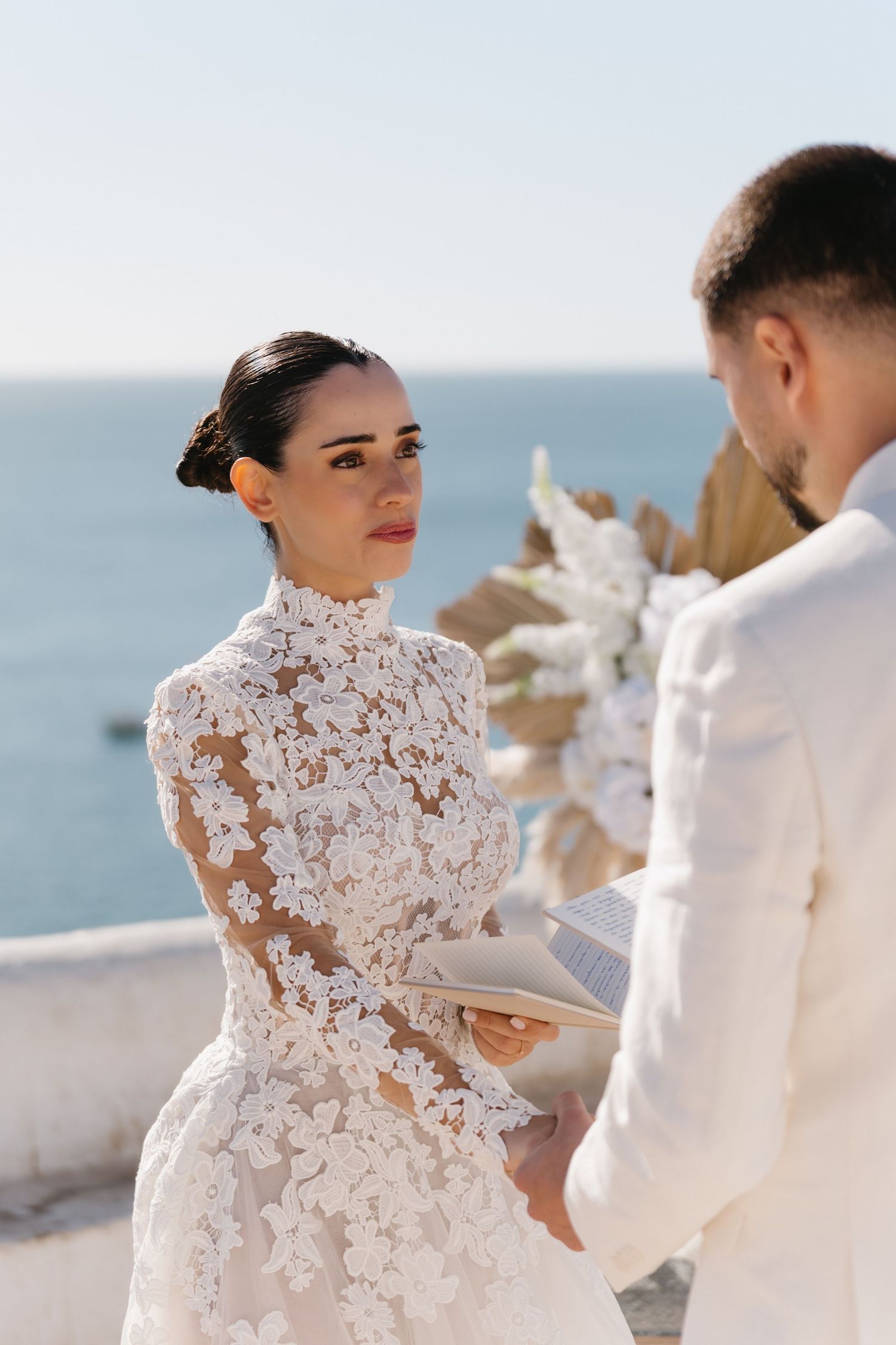 bride looking to groom during the vows