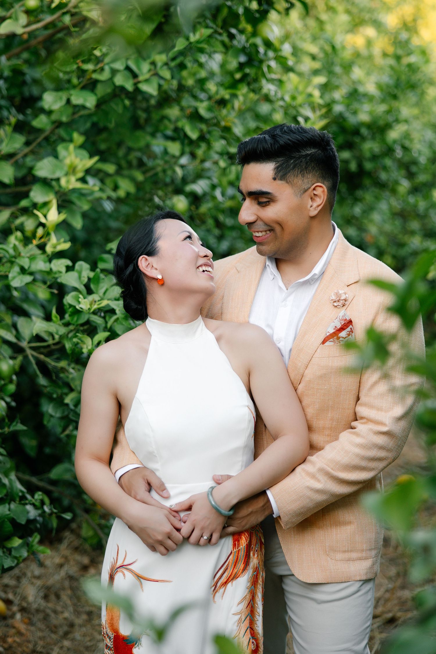 Lovely hug in the orange fields of the algarve during their wedding