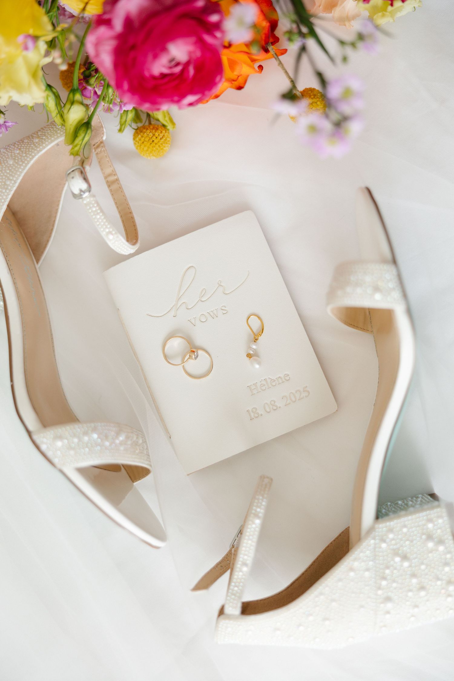 Close-up of bride’s elegant wedding earrings on her wedding day