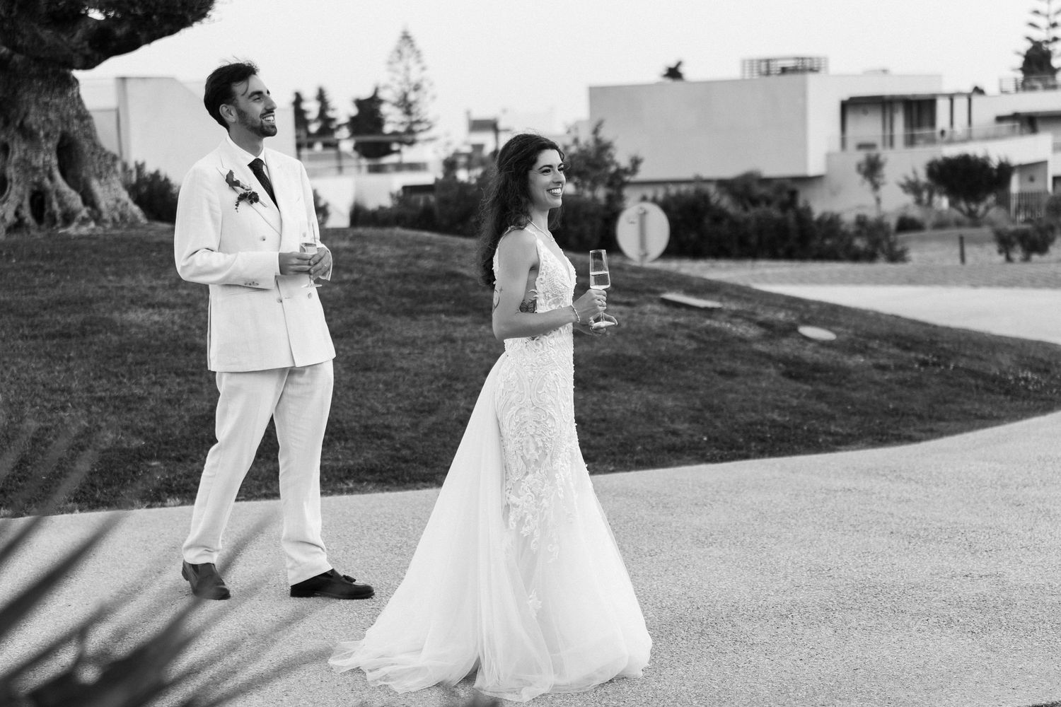 Bride and groom celebrating their wedding at the white shell resort, Algarve Portugal