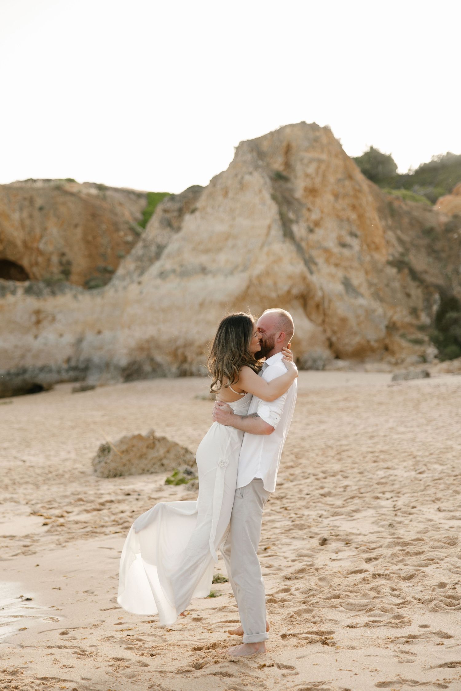 Engagement photographer in Algarve, Portugal capturing romantic beach moments