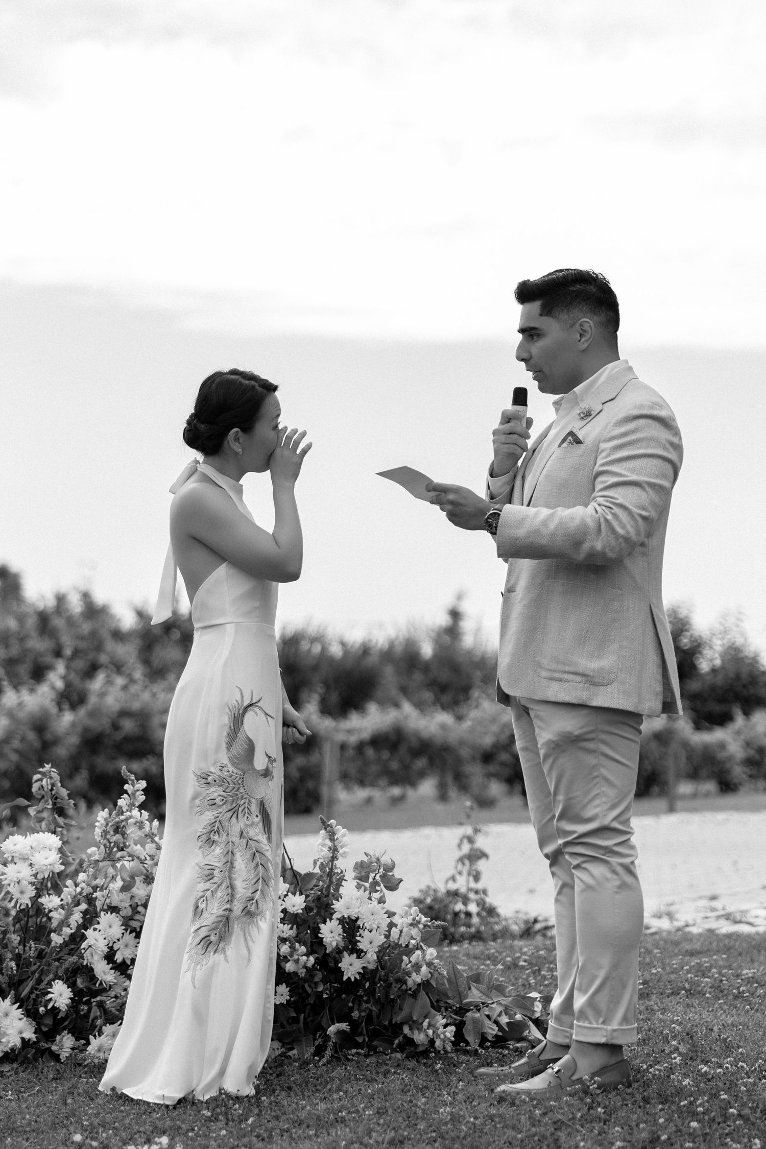 Bride and groom saying their wedding vows surrounded by lush greenery in an Algarve villa garden
