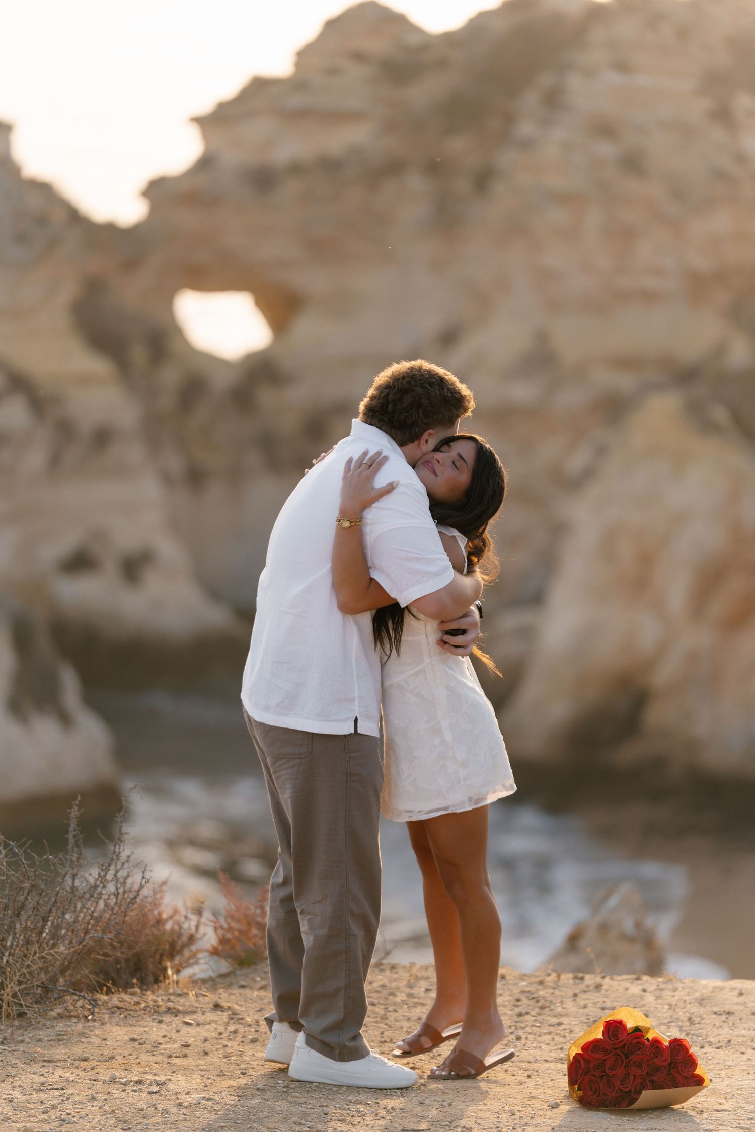 Romantic engagement proposal captured at Três Irmãos beach, Alvor Portugal