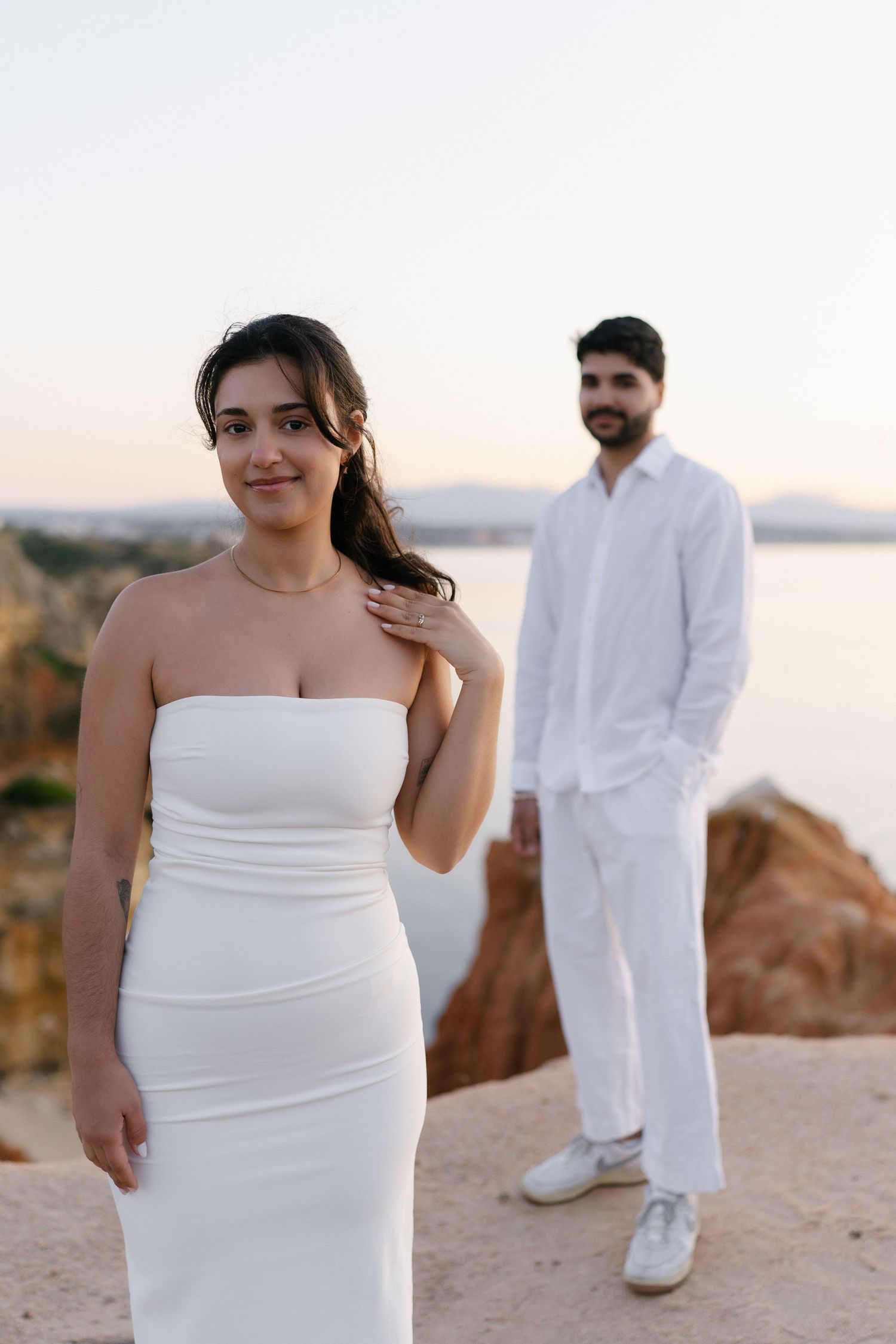 Beautiful couple photoshoot on the cliffs in Lagos during sunrise capturing a romantic moment