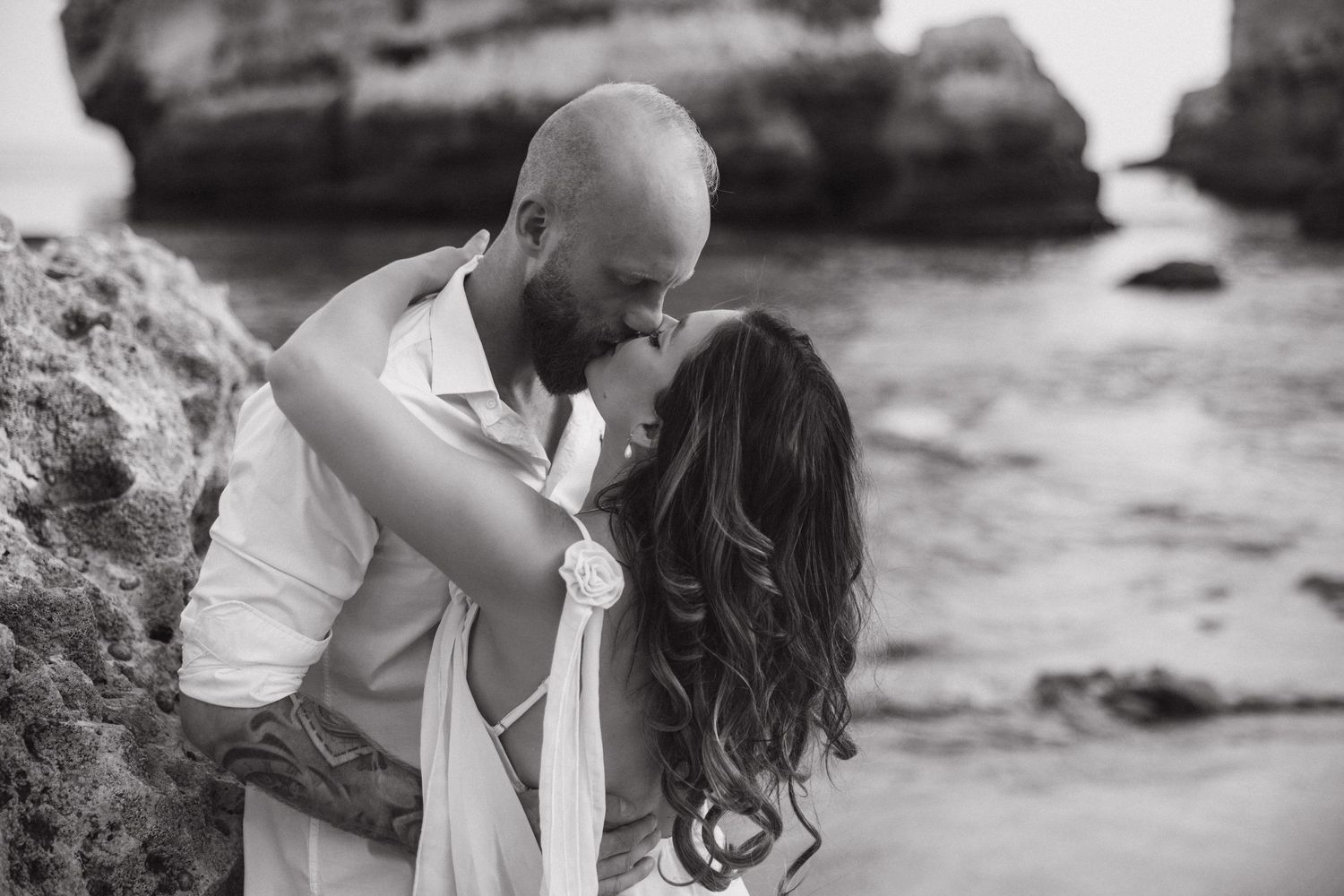 Engagement photographer in Algarve, Portugal capturing romantic beach moment