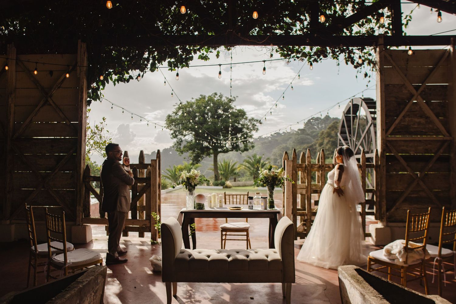 A series of wedding venue photos showing rustic barn interiors and outdoor ceremony spaces with mountain views.