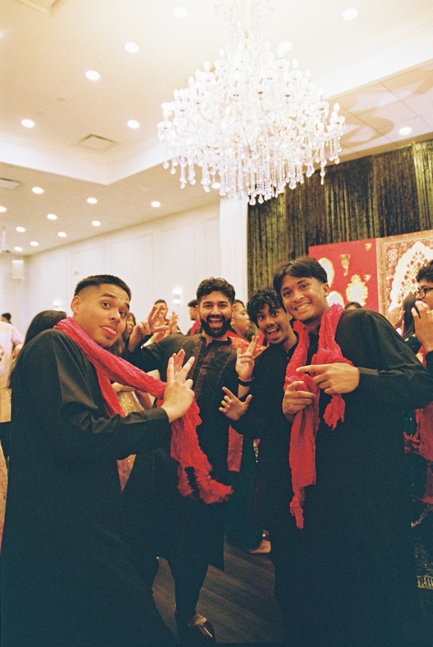 Groomsmen together on the dancefloor.